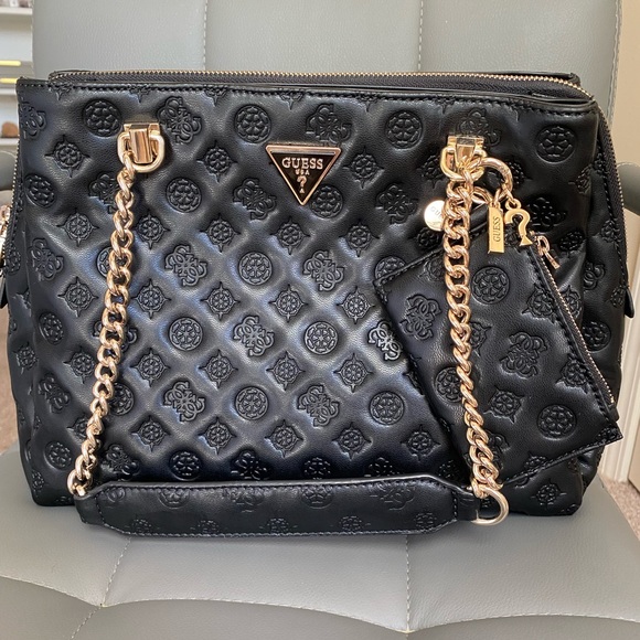 Never used Guess bag bought in Holland! Comes in original dust bag